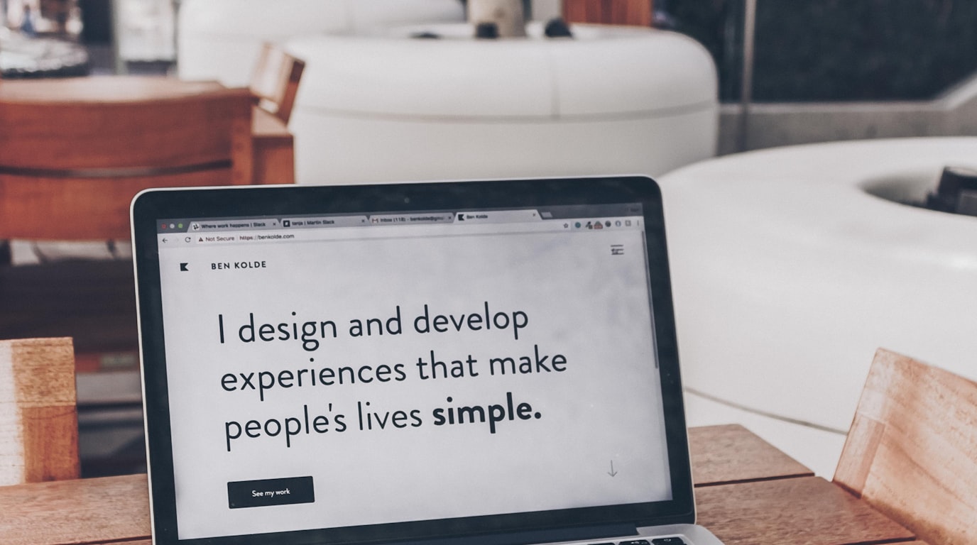 High-converting landing page design wireframes and analytics on a dual-screen workstation