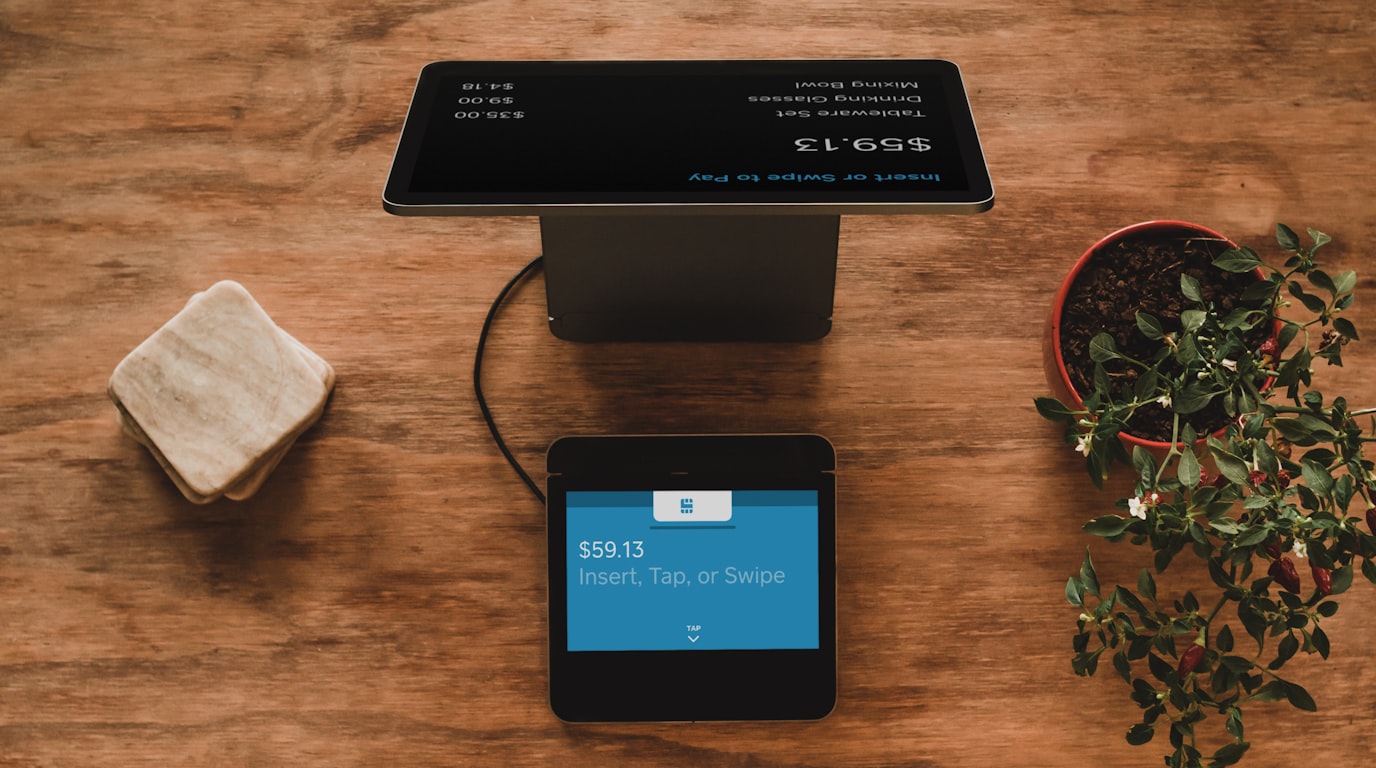Modern e-commerce retail setup with payment terminal and packaged product orders